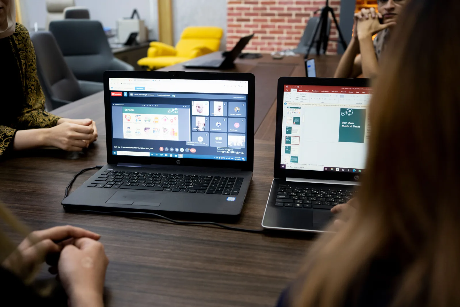 Team discusses projects during a virtual and in-person meeting in a Dubai office. Federal Grant Review: How to Check Claims and Offers
