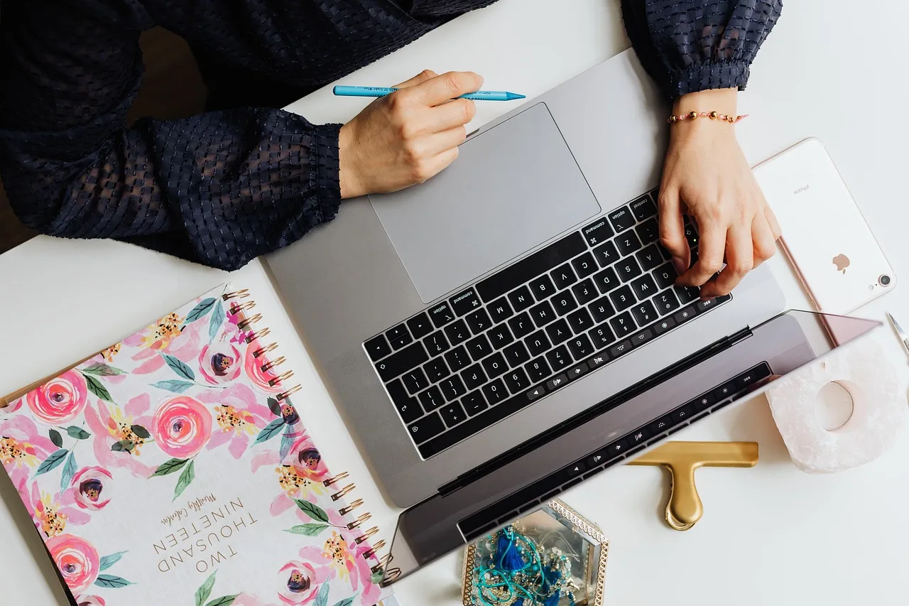 laptop, technology, book, woman, pen, computer. Grants for women checklist: WOSB, SAM.gov and file renewals