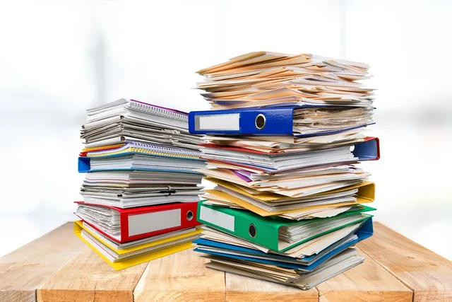 folders, files, office, binders, desk, paper, stack of paper, office work, paperwork, documents, folders, paperwork, paperwork, paperwork, paperwork, paperwork. State grant mistakes to check before signing